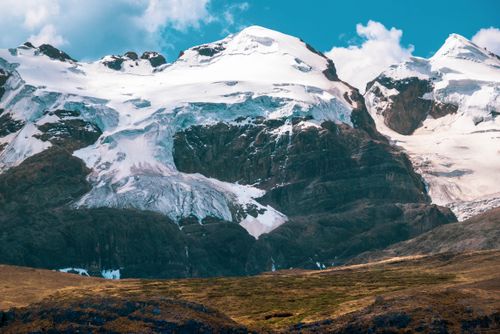 Free Breathtaking view of snow-covered mountains under a clear blue sky. Stock Photo