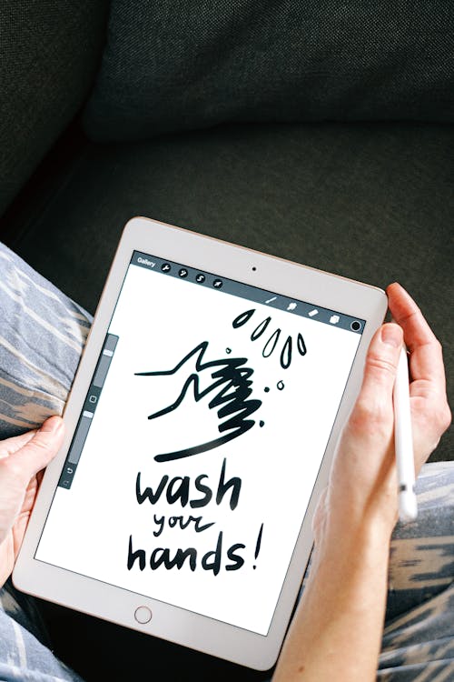 Free Person Drawing on a Tablet Stock Photo