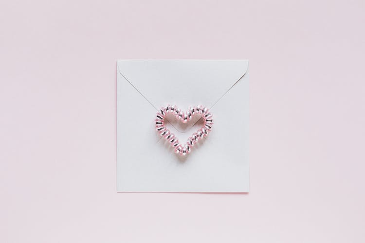 Envelope With Handmade Bead Heart On San Valentines Day