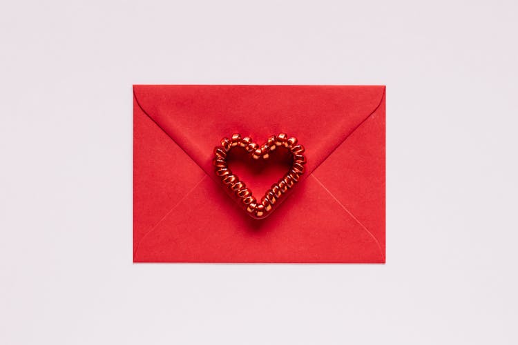 Colorful Gift Envelope With Heart On Pink Background