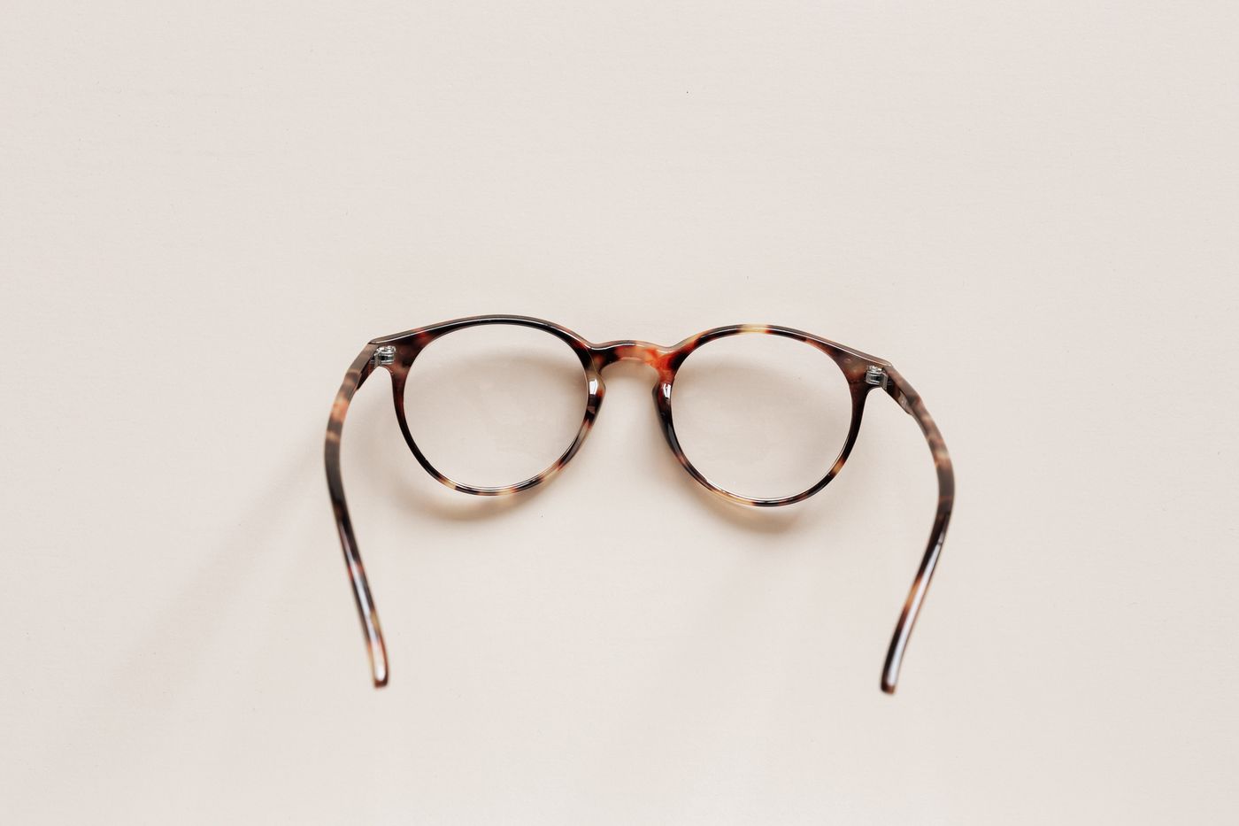 Round tortoiseshell eyeglass frame as a still-life object