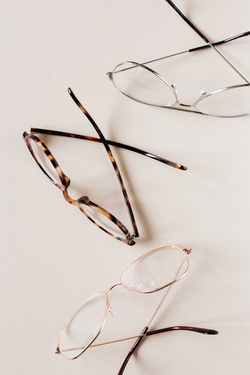 Free Stylish various eyeglasses on beige background Stock Photo