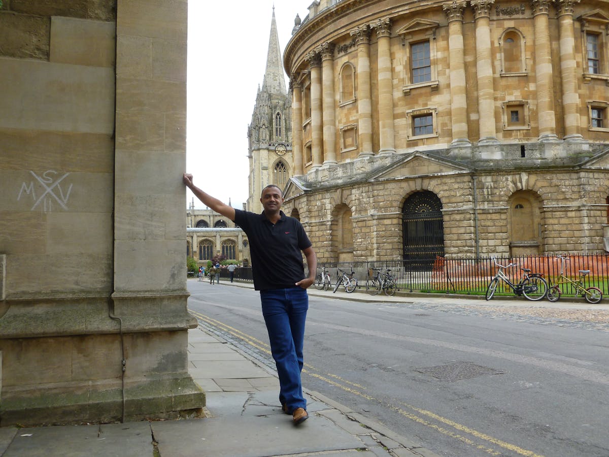 Healthcare worker taking a patient's blood pressure using a cuff