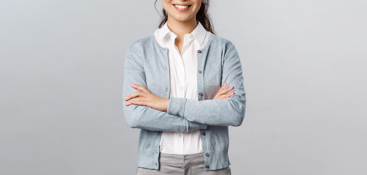 Woman in straight jeans with blouse and cardigan