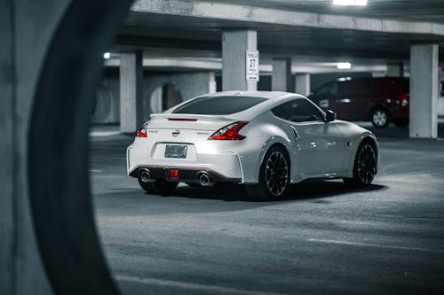 Luxury shiny coupe car on concrete parking lot