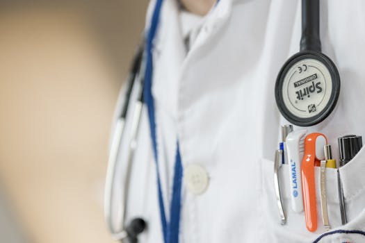 Macro Photo of Stethoscope and Pens