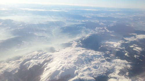 Free stock photo of airplane puffs, flying, mountains Stock Photo