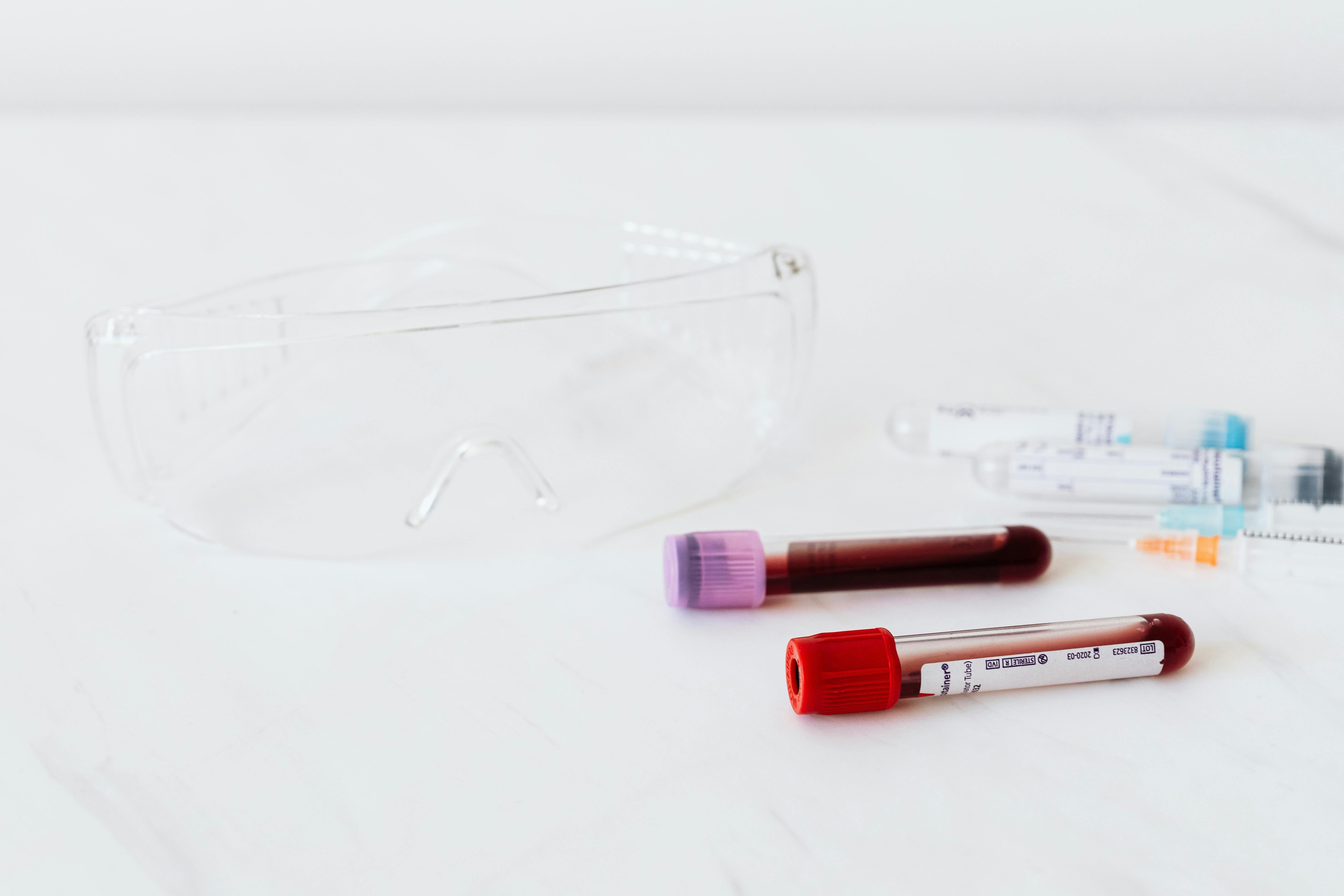 Full vials of blood near various medical equipment for taking blood · Free  Stock Photo