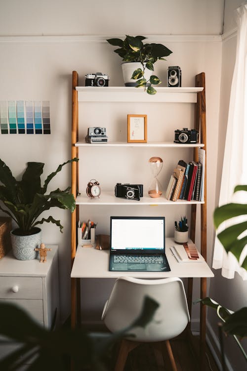 Macbook Pro on White Wooden Table