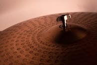 Metal cymbals with geometric pattern on surface