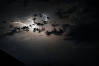 Silhouette of Tree Under Cloudy Sky