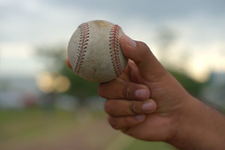 Male Hand Holding Tennis Ball