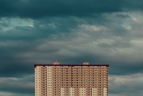 Free A striking view of a residential building in Krasnodar against a dramatic sky. Stock Photo
