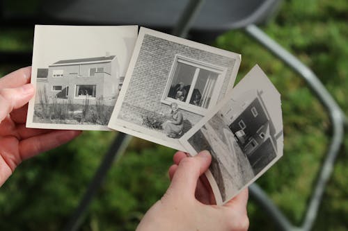 Hands Holding Old Photos