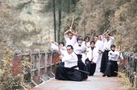 People Holding Katana Swords