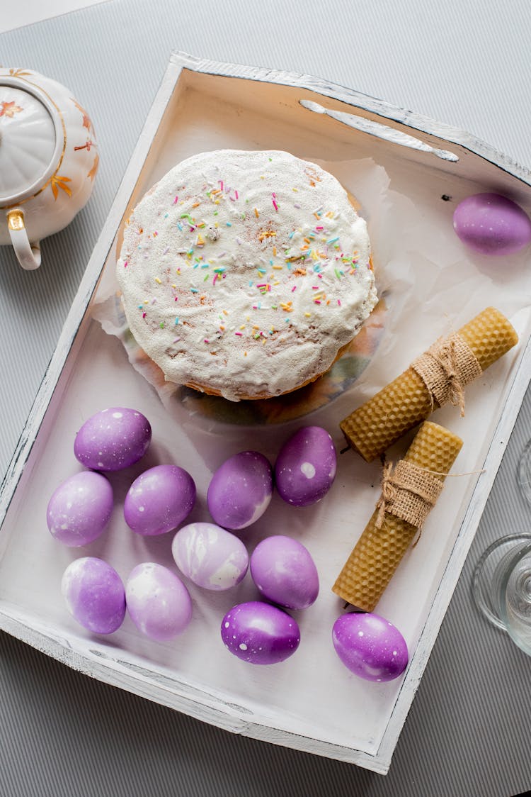 Easter Cake And Purple Eggs On White Tray