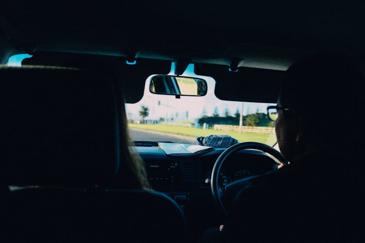 Unrecognizable Persons Riding Right Hand Drive Car