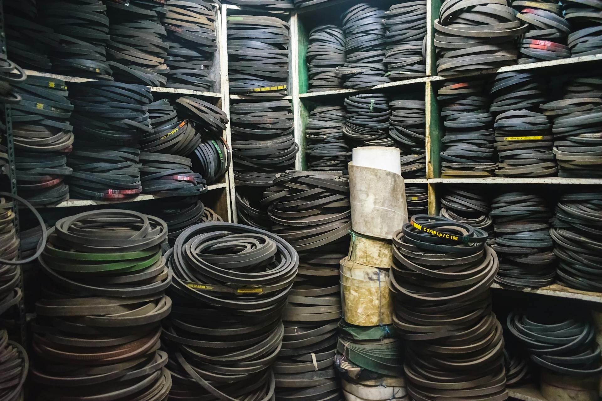 Lots of Rubber Belts on Shelves and Floor