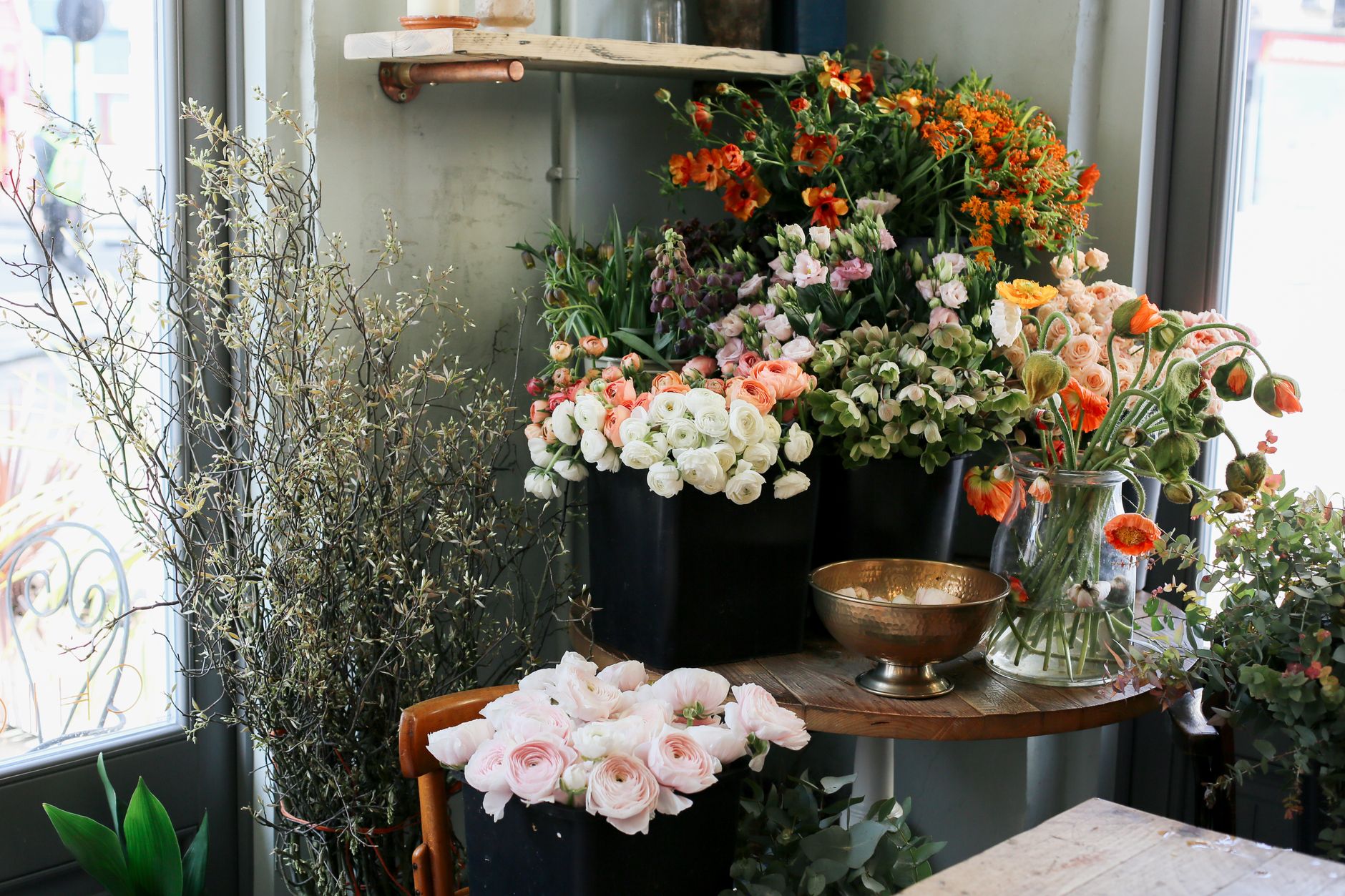 Beautiful display of fresh flowers in a cozy flower shop, perfect for floral decor inspiration.
