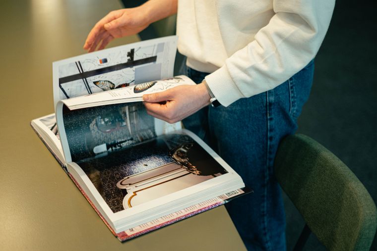 Reading a printed design manifesto -- photo by Ivan S on Pexels