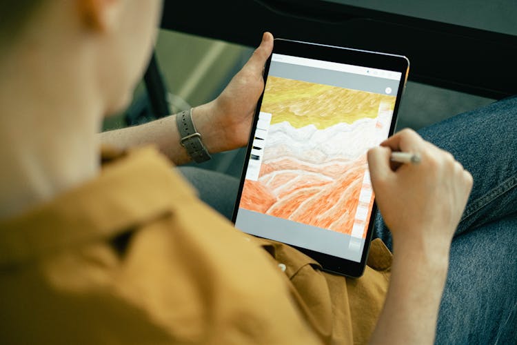 Person Drawing On A Tablet