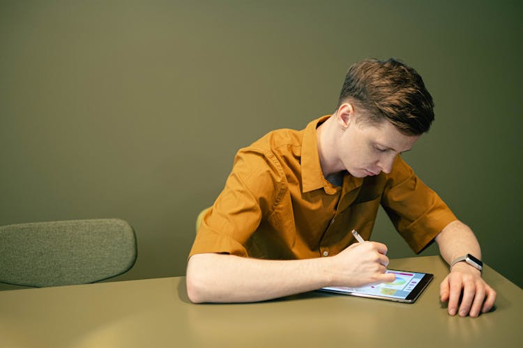 Man Drawing On A Tablet