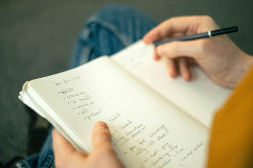 Person Writing a to do List