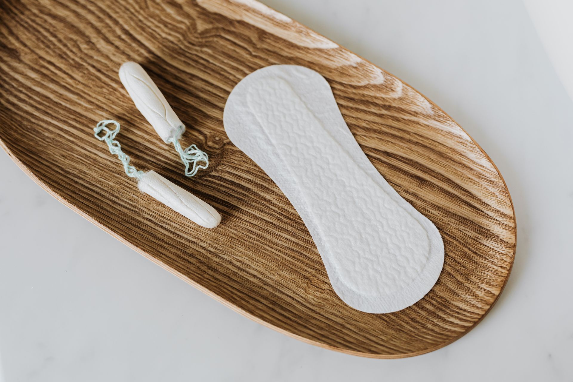 Products of personal hygiene for women on wooden stand