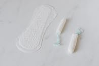 Tampons and daily liner on white surface