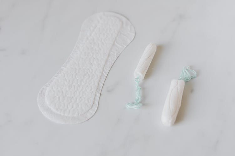 Tampons And Daily Liner On White Surface