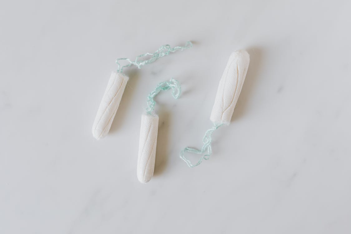 Set of menstrual tampons on white table