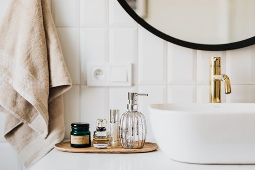 Skincare products arranged on a stone counter