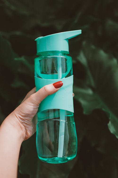 Free Photo of a Person's Hand Holding a Mint Green Tumbler Stock Photo
