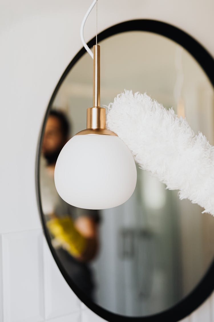 Person Wiping Off Dust On Lamp With Brush Dust Cleaner