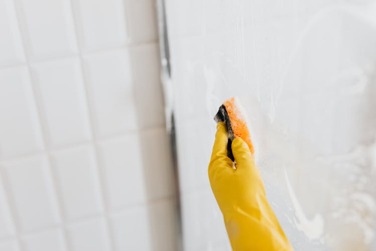 Person In Glove Washing Walk In Shower Glass