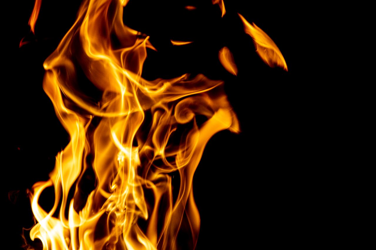 captivating image of fiery flames rising against a black backdrop show