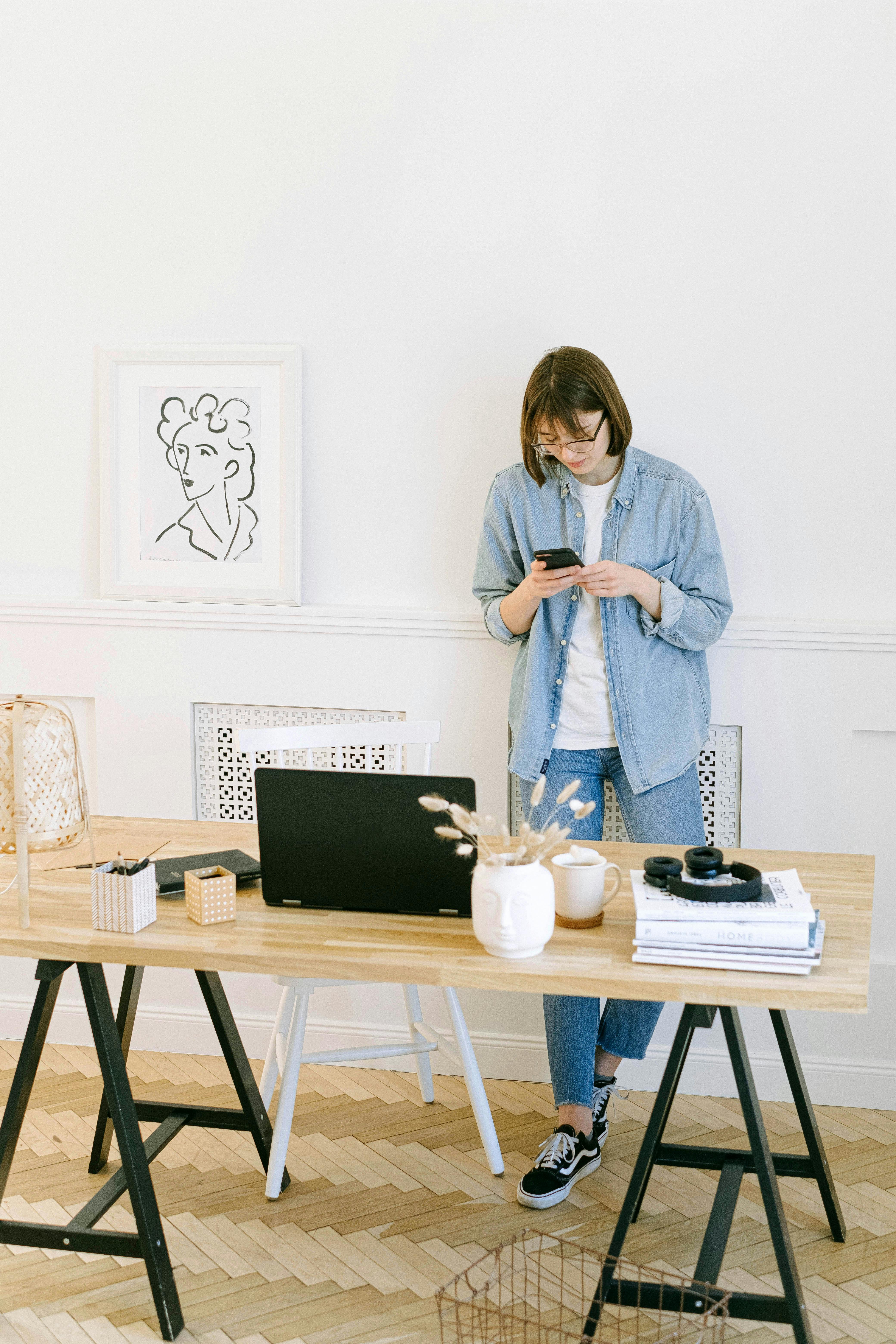 standing woman using her smartphone