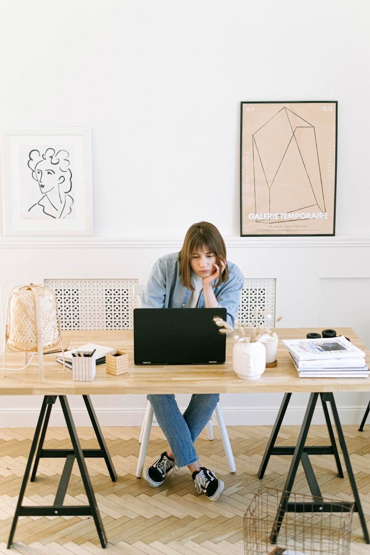 Bored Woman Looking At A Laptop