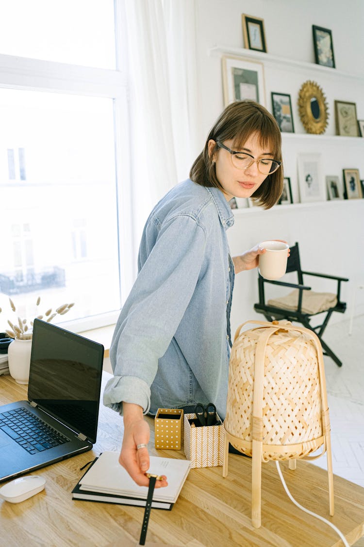 Woman Checking Time In Office