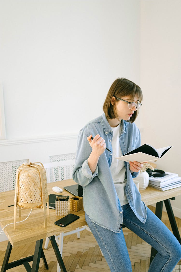 Woman Reading Her Notebook