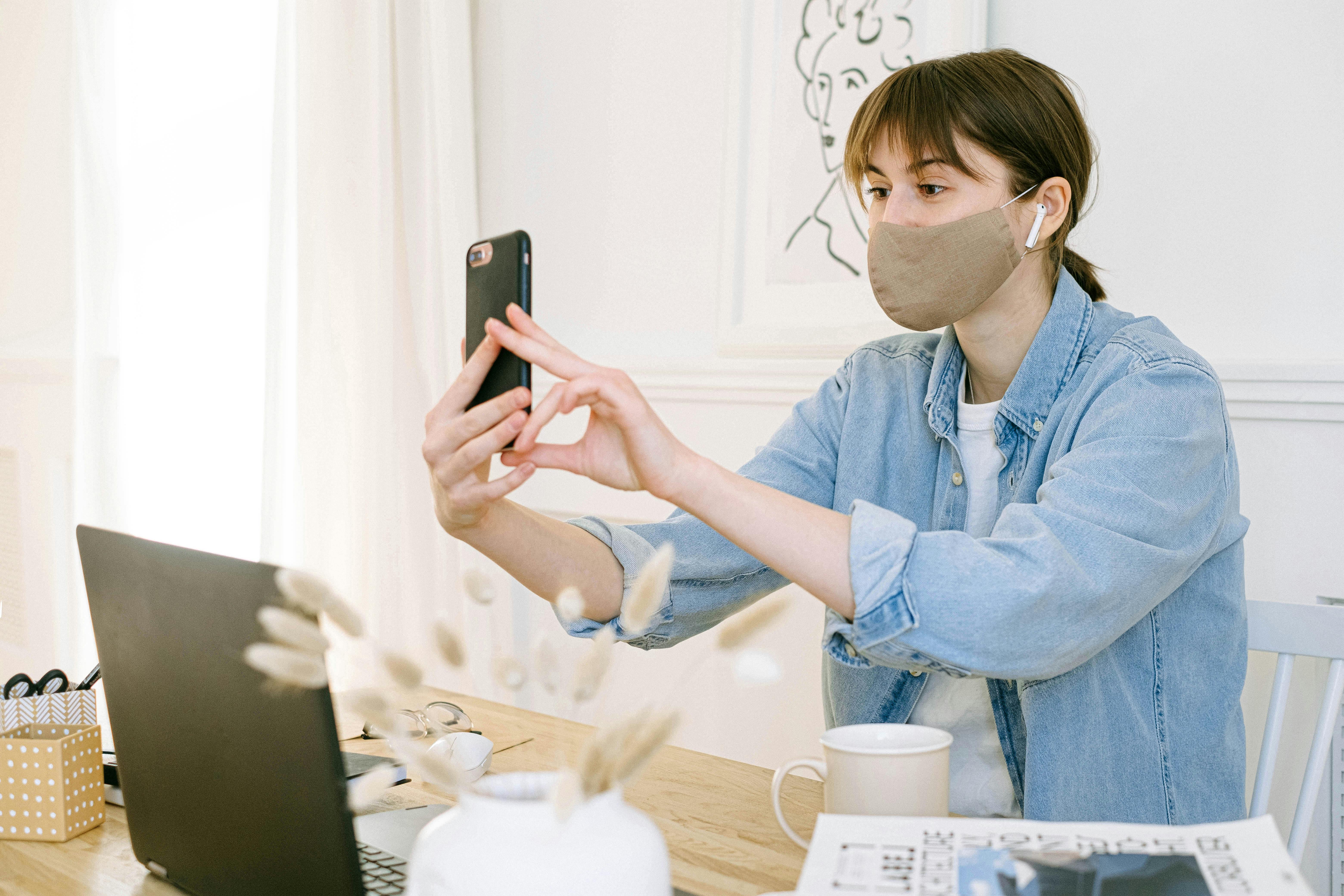 woman in face mask having video call