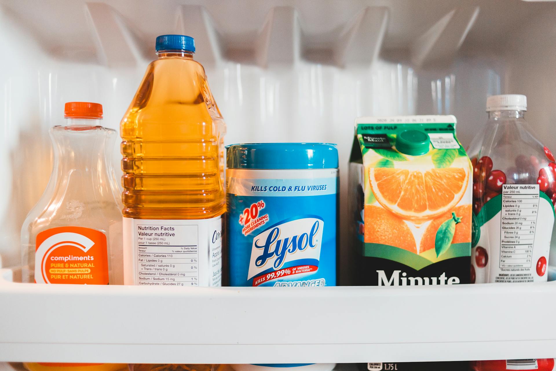 Bottles with assorted juices in refrigerator
