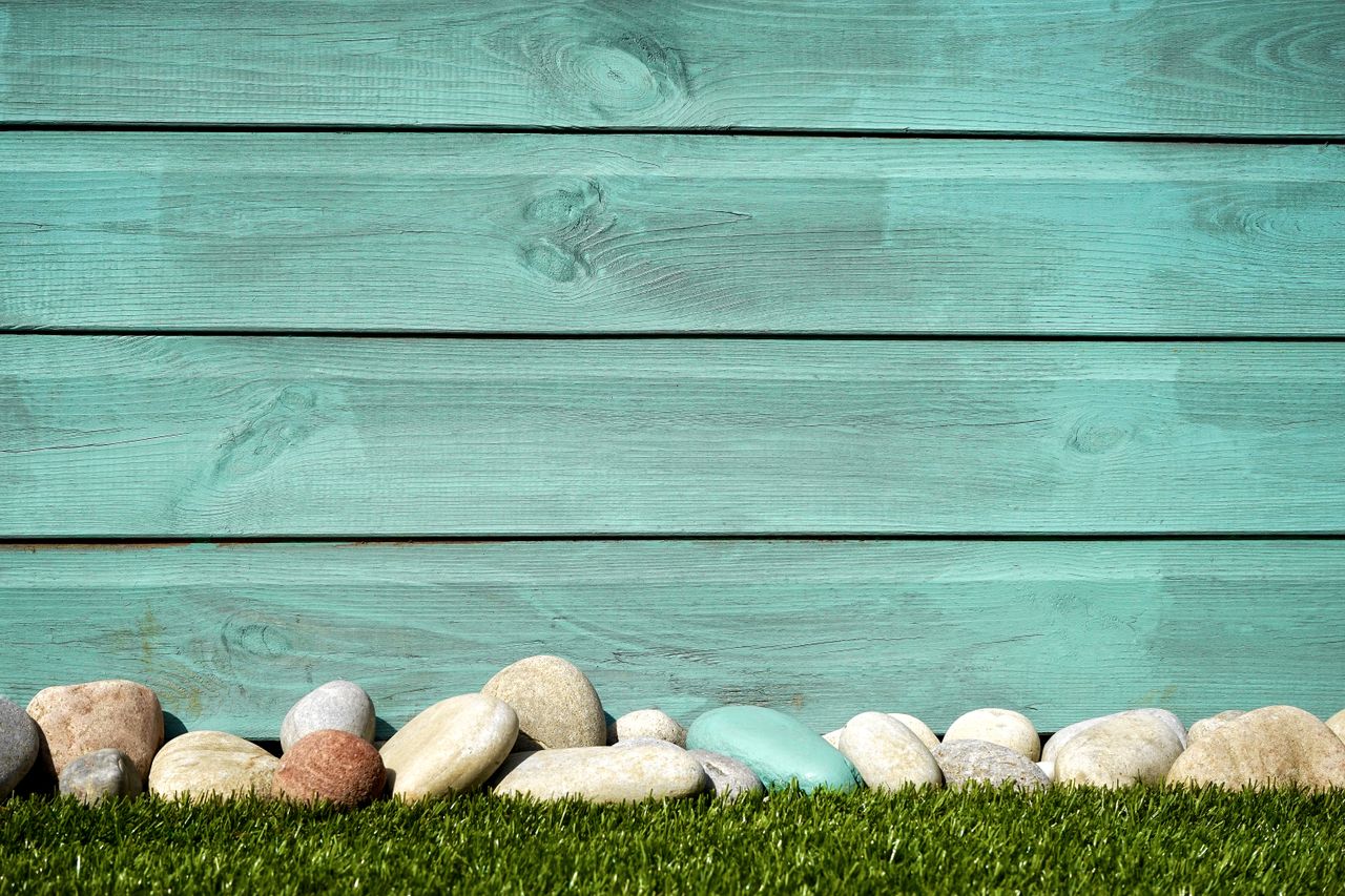 turquoise wooden planks with pebbles and grass perfect for a serene ba