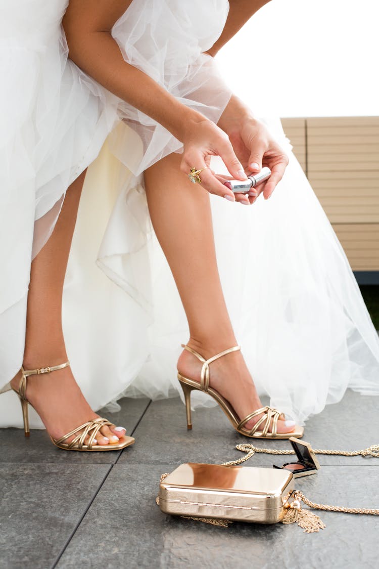 Crop Bride With Makeup Tools Before Wedding Ceremony