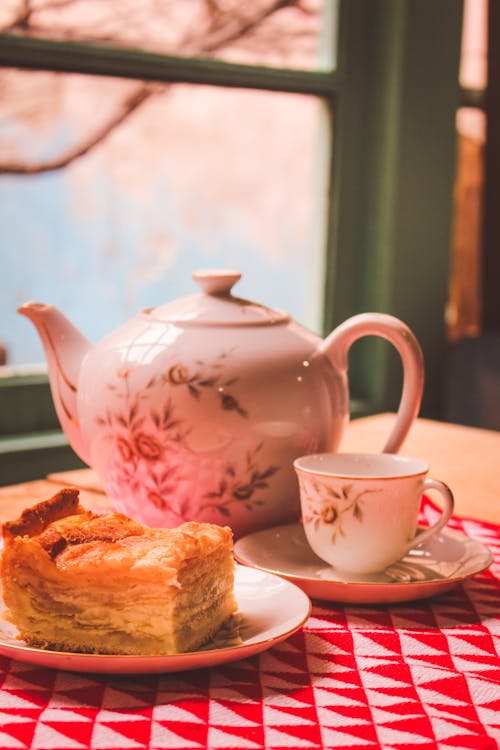 Tea set and palatable pie served on table during traditional ceremony