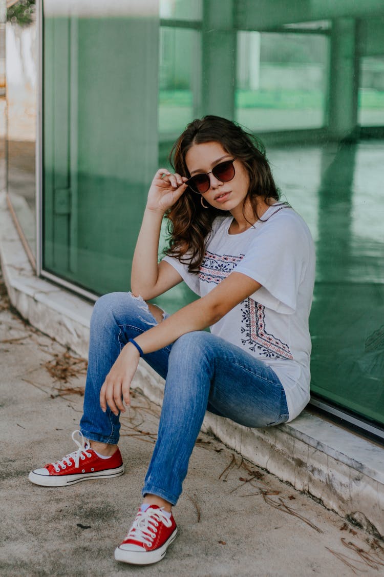 Young Female Resting On Curb