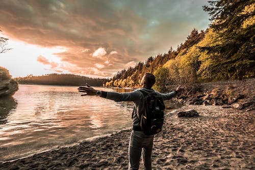 Free Close-Up Shot of a Man Standing near the Lake  Stock Photo