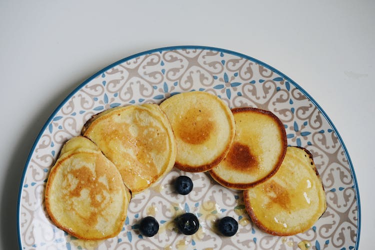 Pancakes And Blueberry On Table