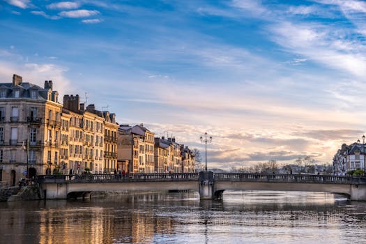 Beautiful view of a bridge over the river in Bayonne, Nouvelle-Aquitaine during sunset.