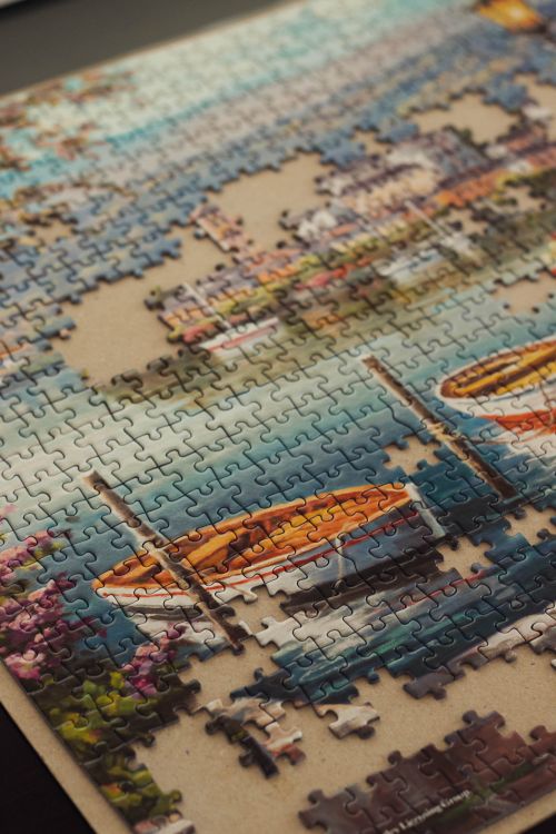 Free From below of colorful cardboard puzzle without pieces in bright room in daylight Stock Photo